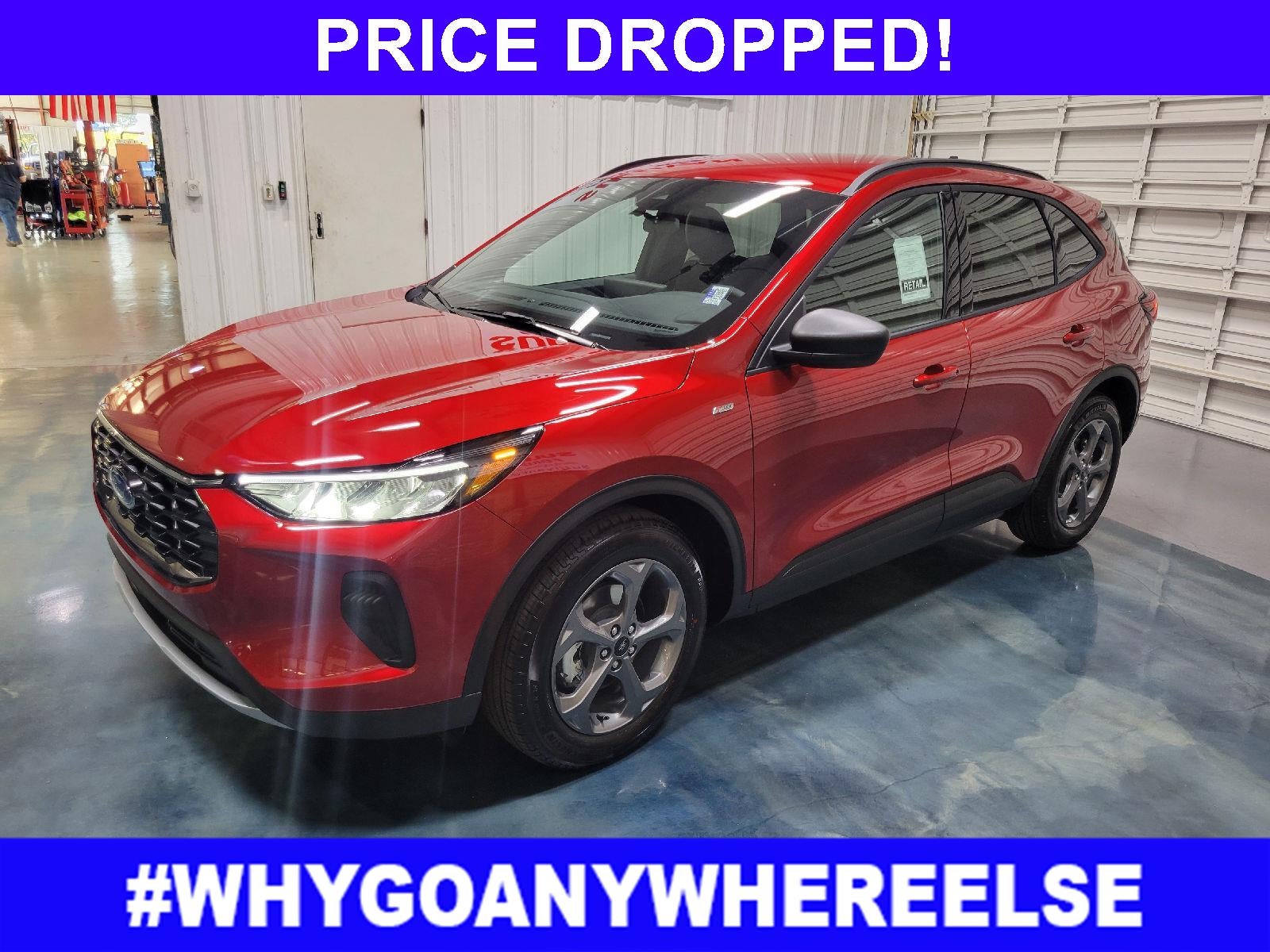 2026 Ford Escape ST-Line in Rapid Red Metallic Tinted Clearcoat — front three-quarter view