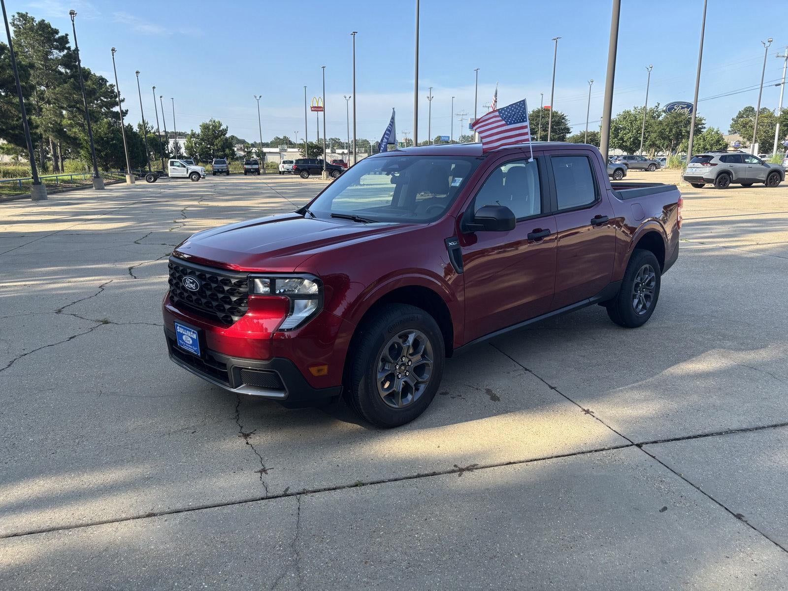 2026 Ford Maverick XLT in Ruby Red Metallic Tinted Clearcoat — front three-quarter view